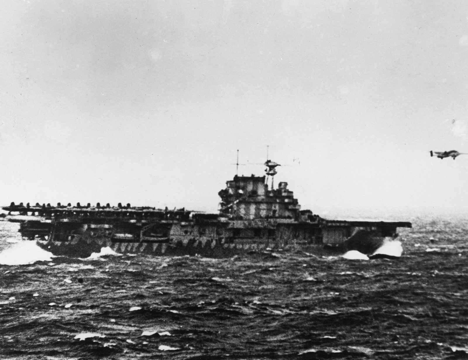 A B-25 bomber climbs away from the carrier USS Hornet in heavy seas at the start of the Doolittle Raid, 18 April 1942