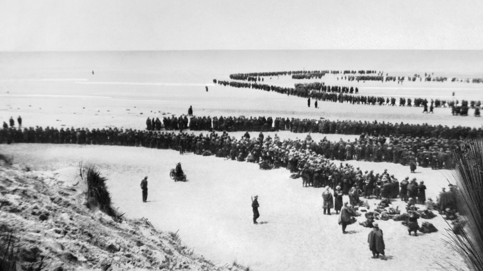 British troops lining up on the beach at Dunkirk to await evacuation, late May 1940