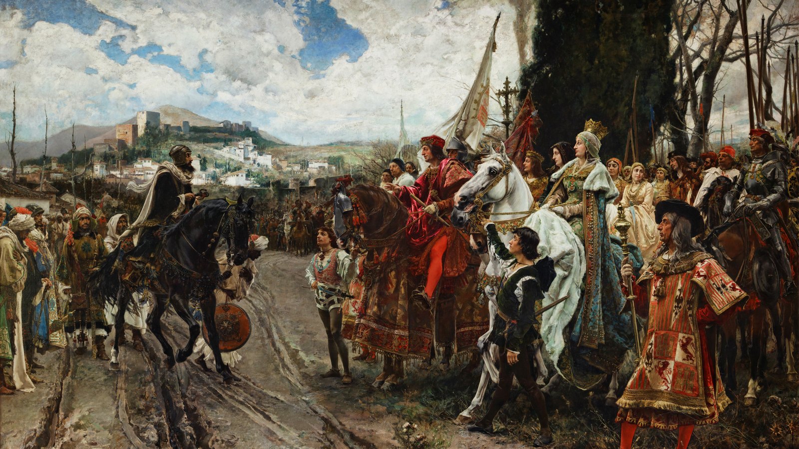 Duży obraz olejny przedstawiający ceremonię pod miastem: mauretański król w turbanie na czarnym koniu podjeżdża do chrześcijańskiego króla w czerwonym aksamicie i królowej w koronie, w bieli i złocie, na białym koniu, otoczonych dworzanami, chorągwiami i rycerzami w zbrojach, a za nimi na wzgórzu widać mury Alhambry.