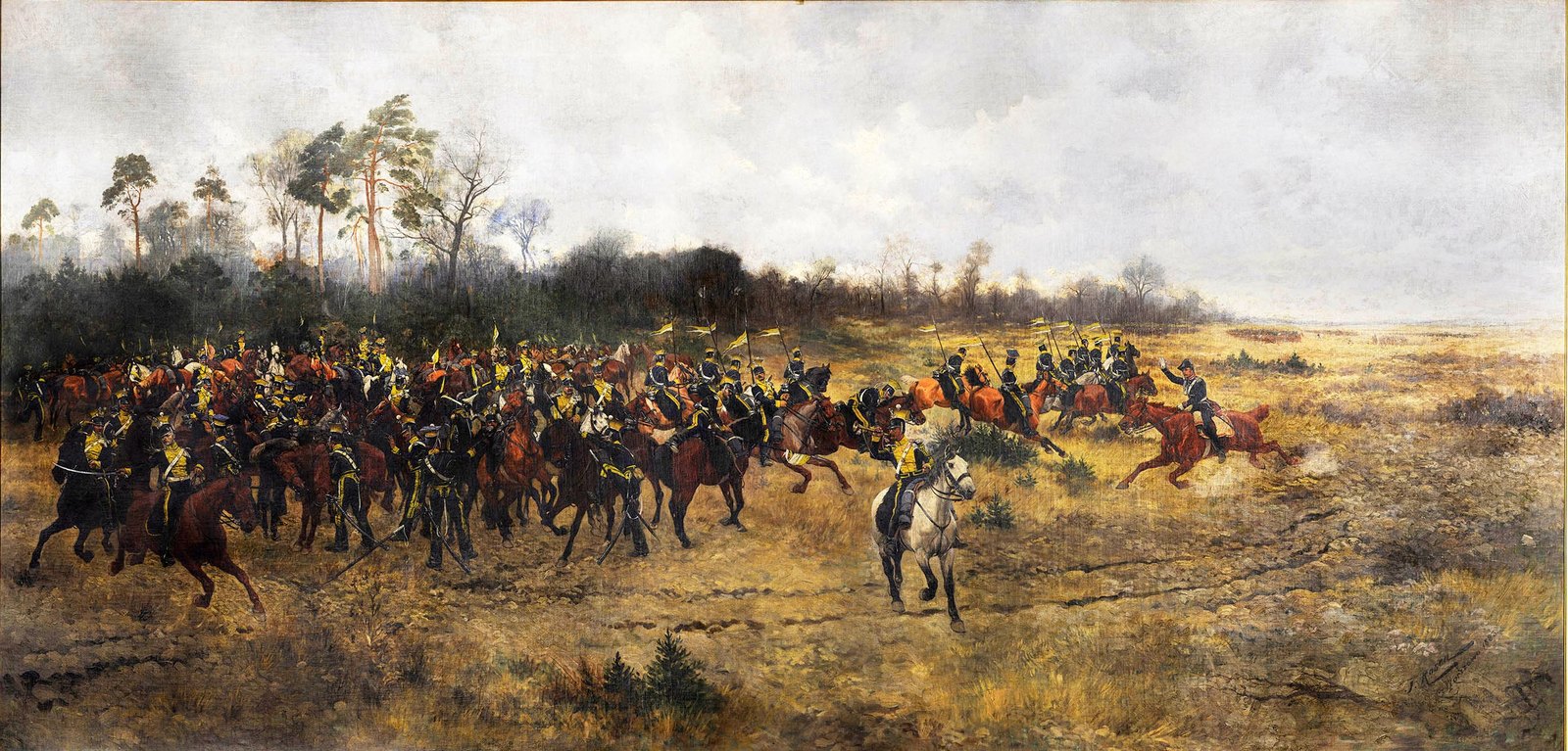 Wide painting of a cavalry regiment galloping across a sandy, scrubby plain under a gray, cloudy sky: a dense mass of riders with lances and small pennants fills the left, an officer on a white horse rides in front of them, a few horsemen on chestnut horses race ahead on the right, and tall pines and a dark wood line the background.