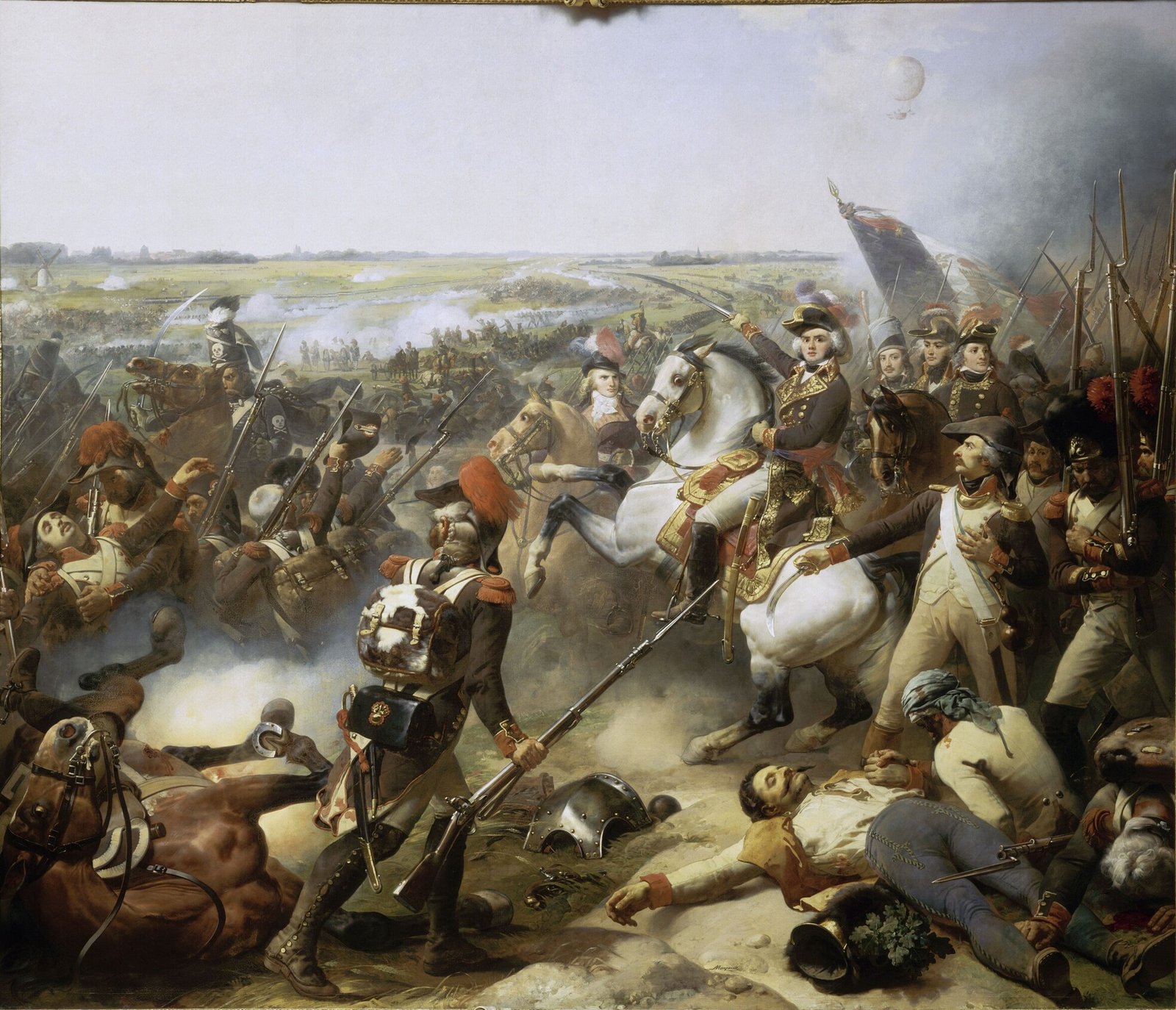 Painting of General Jourdan on a rearing white horse, saber raised, among French grenadiers and officers with a tricolor flag, wounded and dead soldiers and a fallen horse in the foreground, a wide smoky plain behind, and a small observation balloon floating in the sky at upper right.
