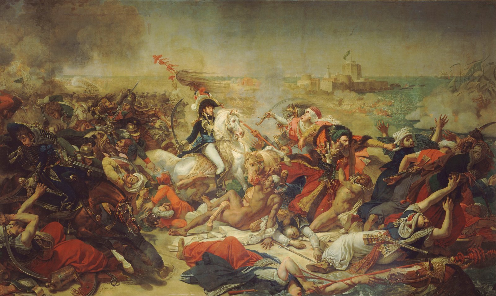 Large battle painting: a French general in a plumed bicorne on a rearing white horse charges into a crowd of Ottoman soldiers in turbans and red and white robes, many of them falling or already dead on the sand, while in the background smoke rises over a coastal fort and men struggle in the sea.