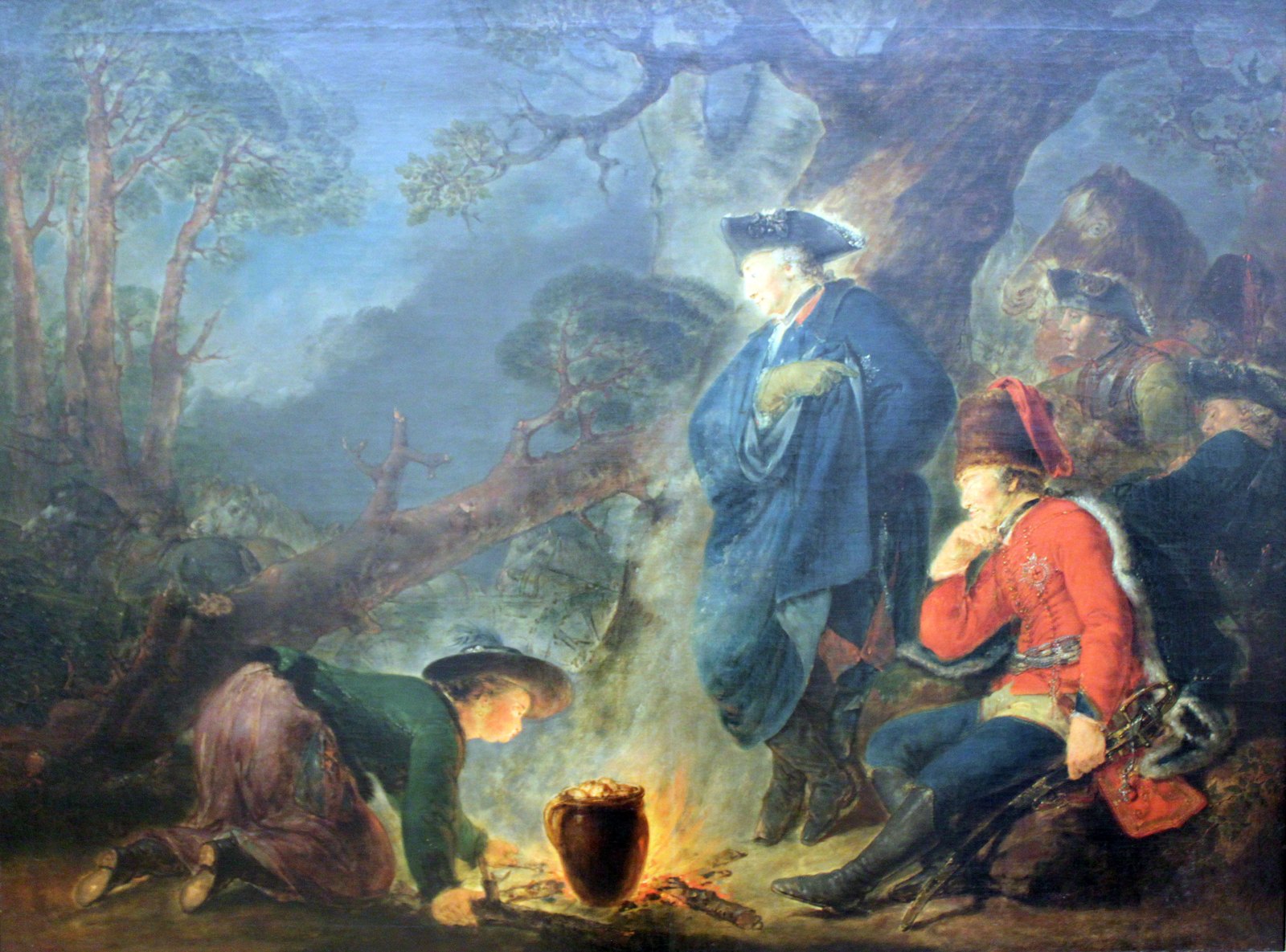 Oil painting of a night camp in a dark forest: a tall man in a blue cloak and tricorne hat stands by a small fire, a hussar officer in a red fur-trimmed jacket and tall fur cap sits dozing beside him, and a kneeling woman in a wide hat blows on the fire under a clay pot.
