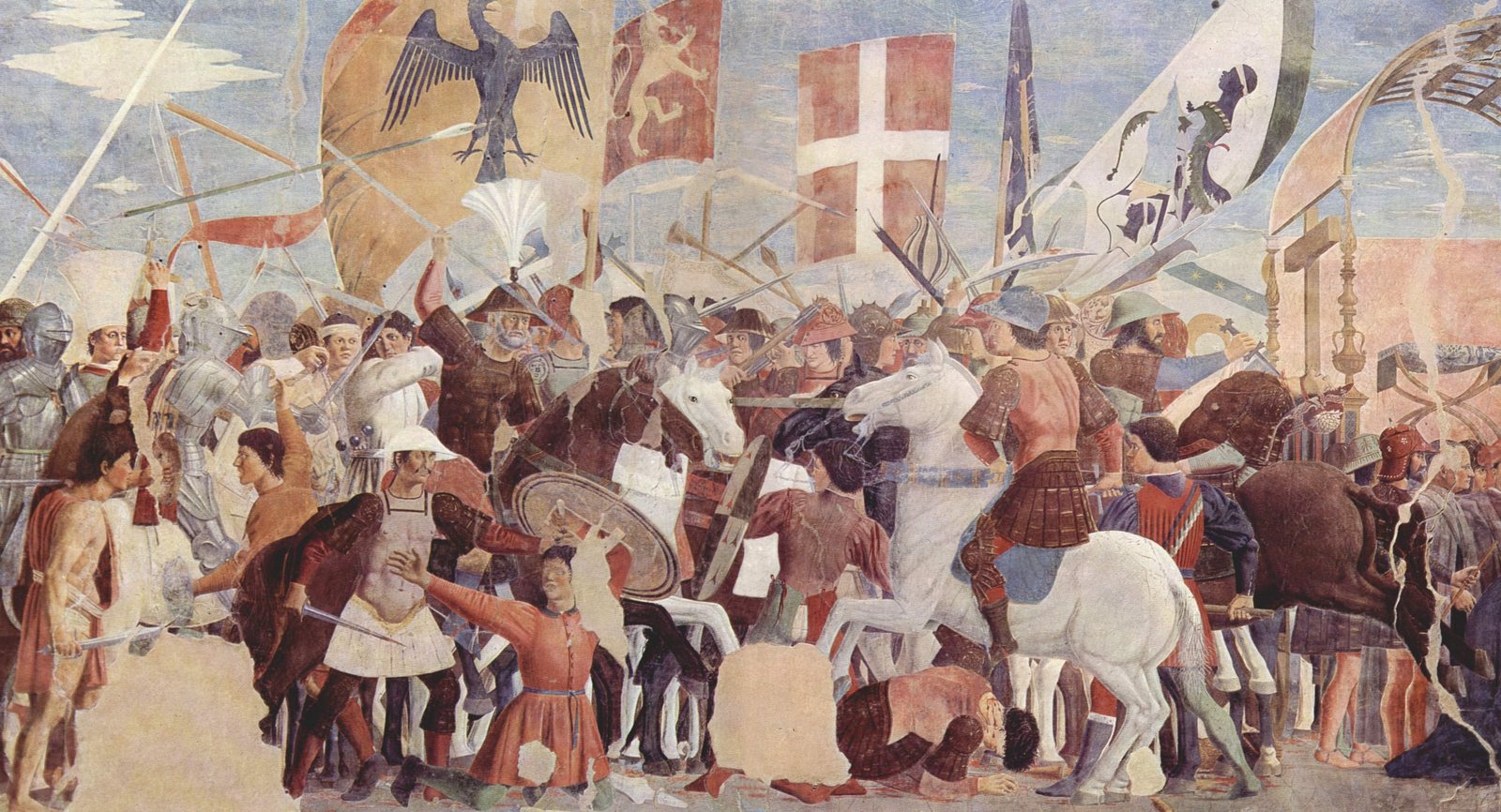 Detail of a Renaissance fresco of a crowded battle: horsemen and foot soldiers in armor and bright tunics fight with swords and lances under banners bearing an eagle, a white cross on red and a lion, while a man is stabbed in the foreground and a white horse rears in the center.