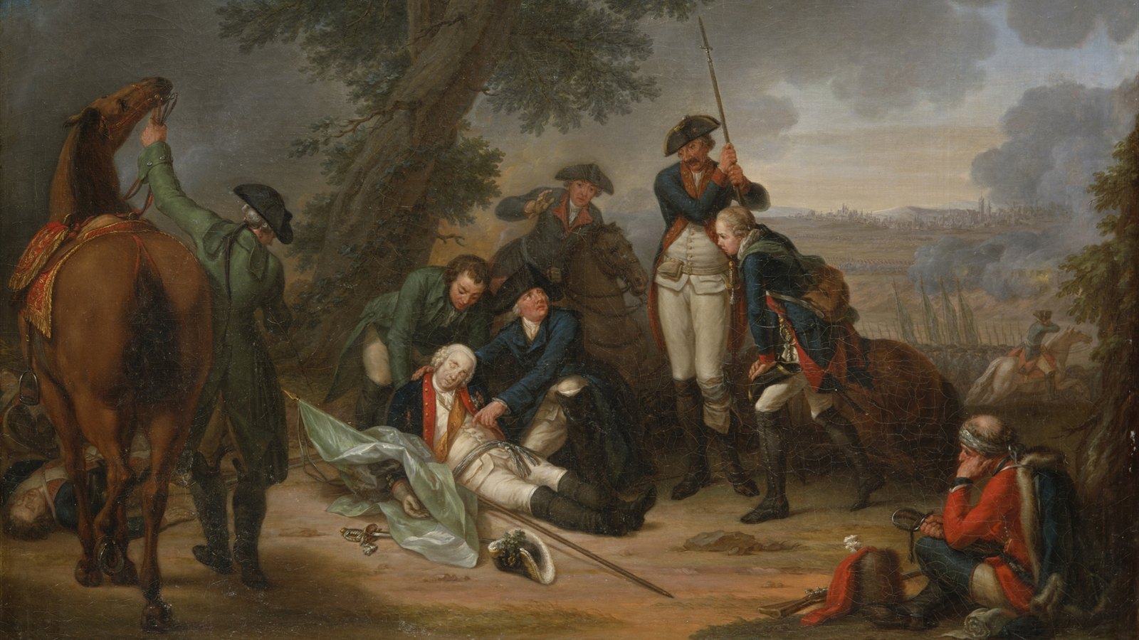 Eighteenth-century painting of the dying Field Marshal Schwerin lying under a tree on a regimental flag, Prussian officers and grenadiers bending over him, a saddled horse on the left and the smoke of battle and the towers of Prague in the distance.
