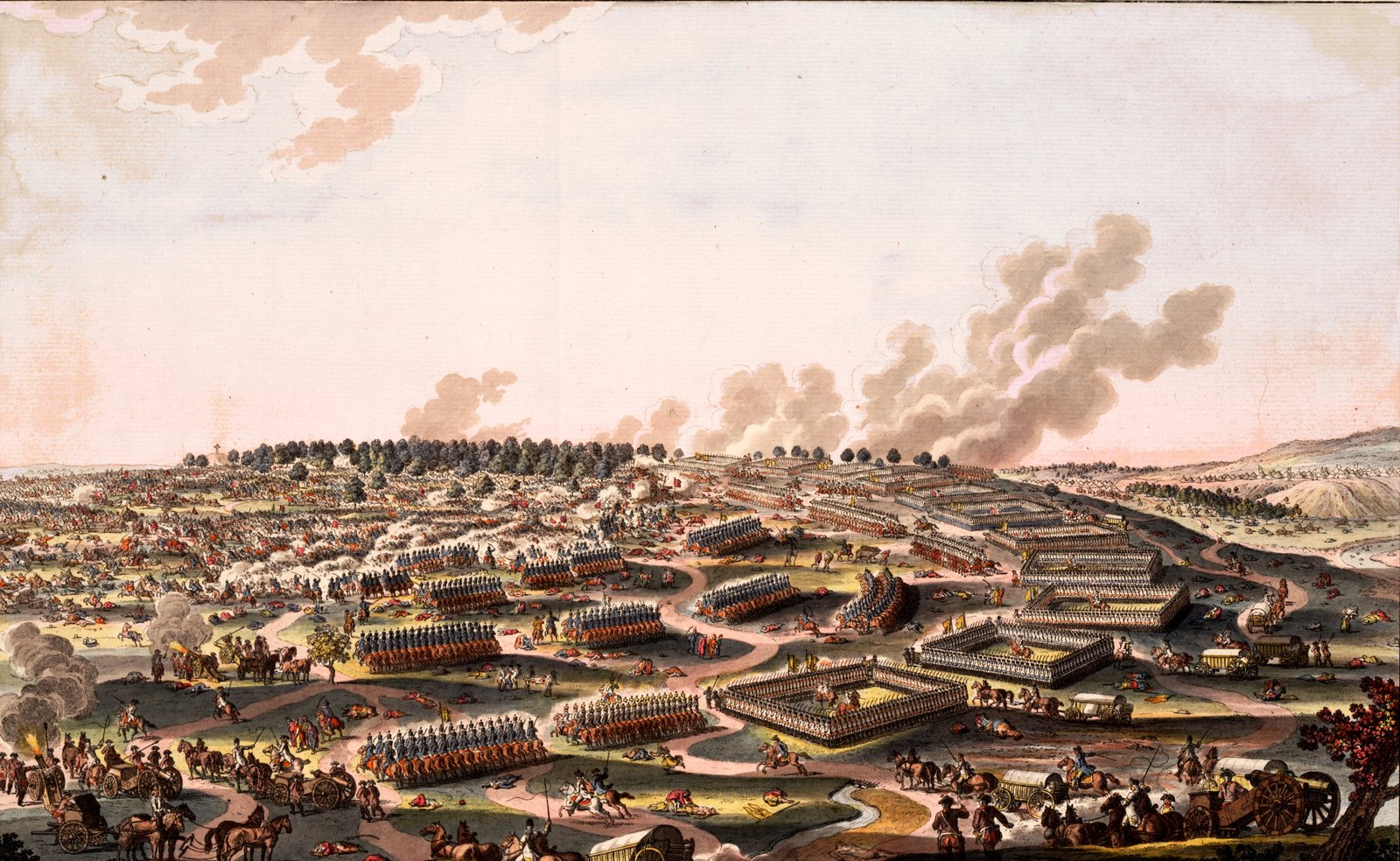Hand-colored eighteenth-century print of a wide battlefield seen from above, with infantry drawn up in hollow squares and lines across green fields, cavalry and wagons along winding roads in the foreground, and clouds of gunsmoke rising over a wood on the horizon.