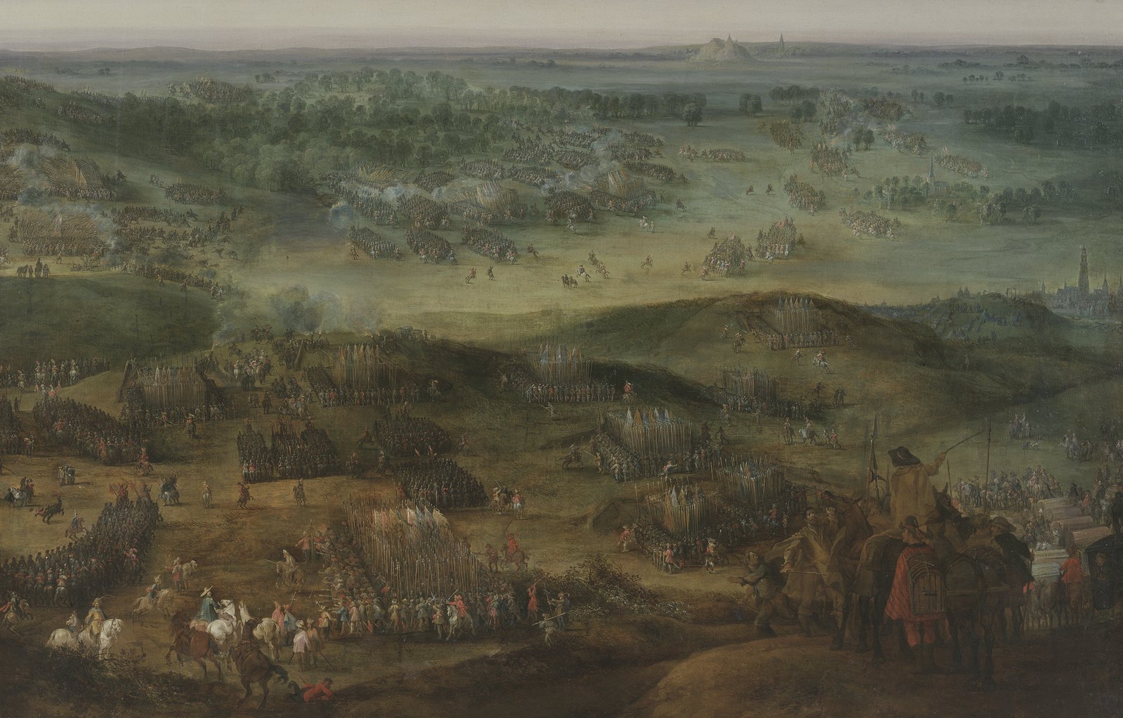 Panoramic oil painting of a battle in rolling green country: blocks of pikemen with flags stand on the hills in the foreground, cavalry and infantry clash across the plain behind, and a town and a hill rise on the horizon.