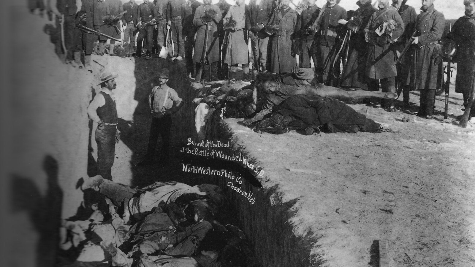Soldiers at a burial for the dead after the Wounded Knee Massacre, South Dakota, 1891