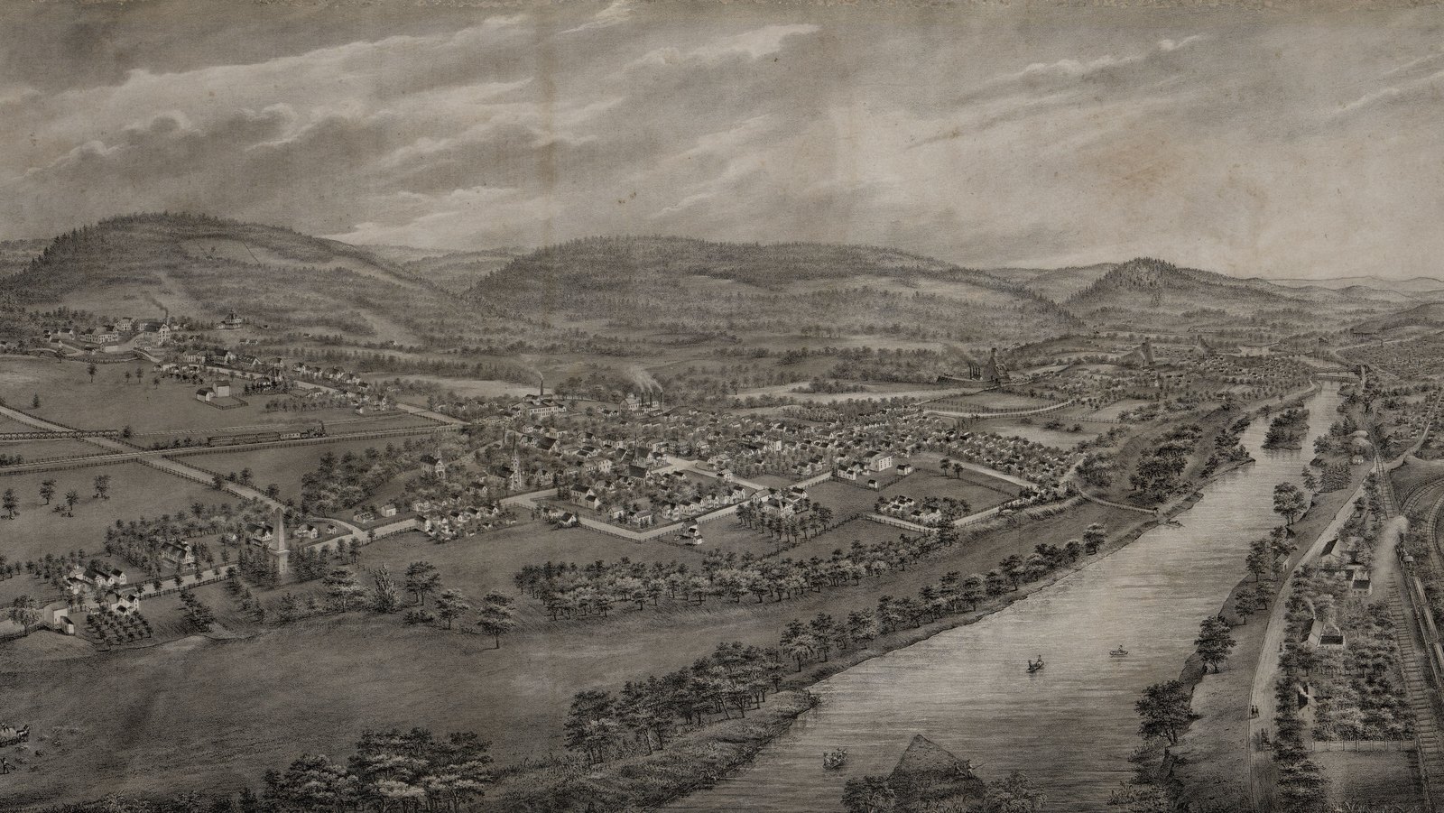 Lithographed 1885 bird's-eye view of the village of Wyoming in Pennsylvania, with houses among fields, the Susquehanna River and wooded hills beyond.