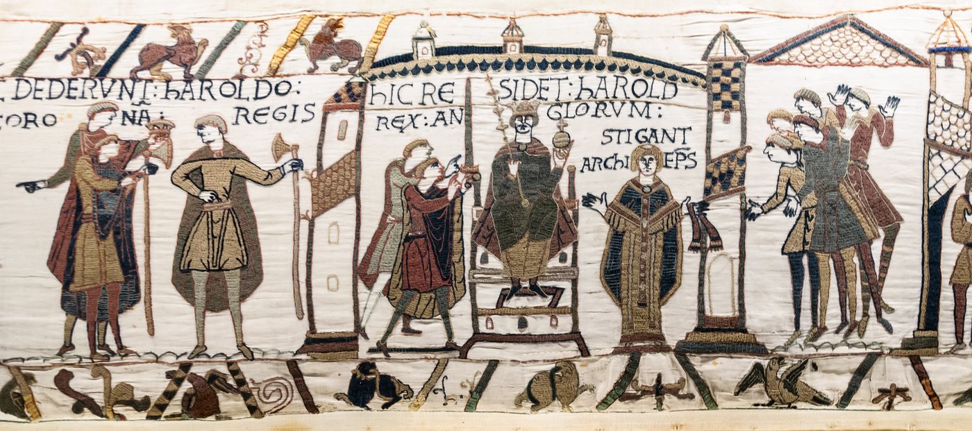 Bayeux Tapestry scene of Harold enthroned with crown and sceptre among nobles and a bishop