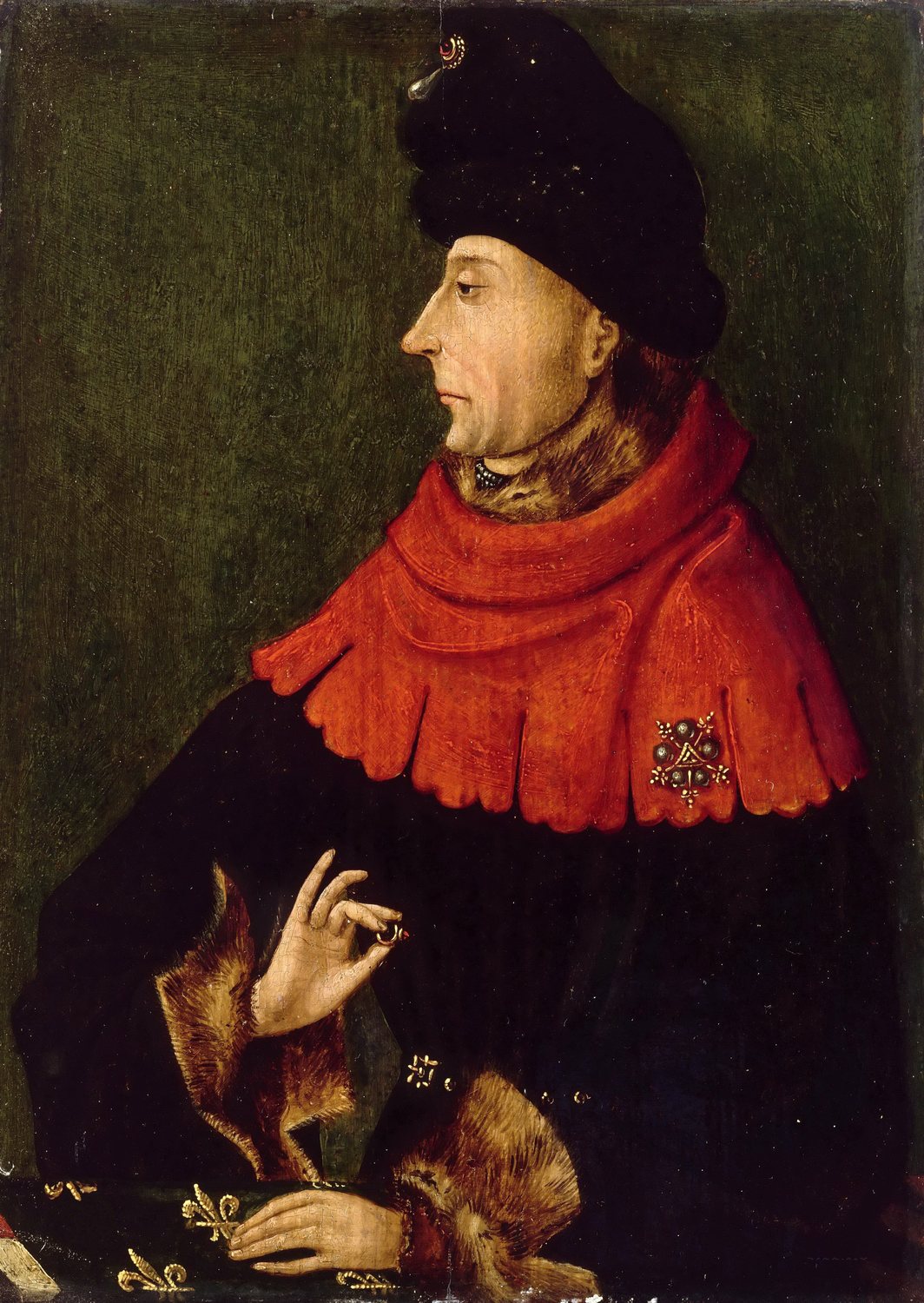 Portrait of a man in a dark chaperon hat and fur trimmed robe holding a ring