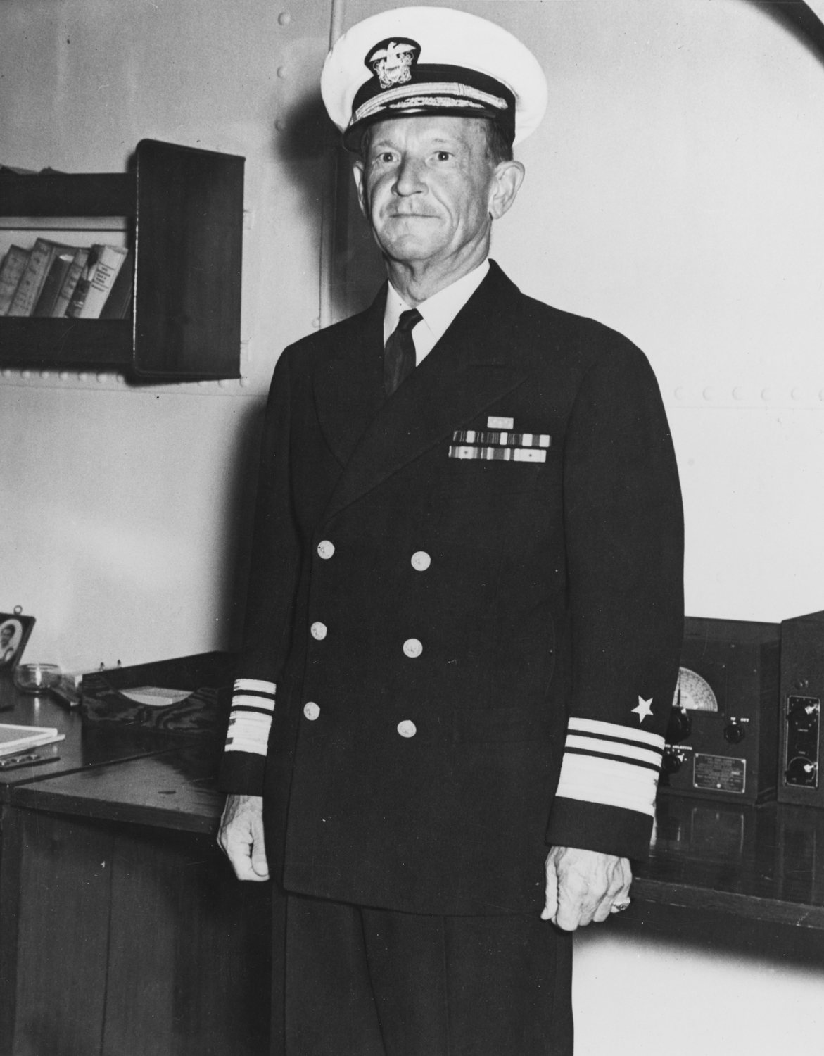 Black and white photograph of Admiral Frank Jack Fletcher in dark naval uniform and white cap