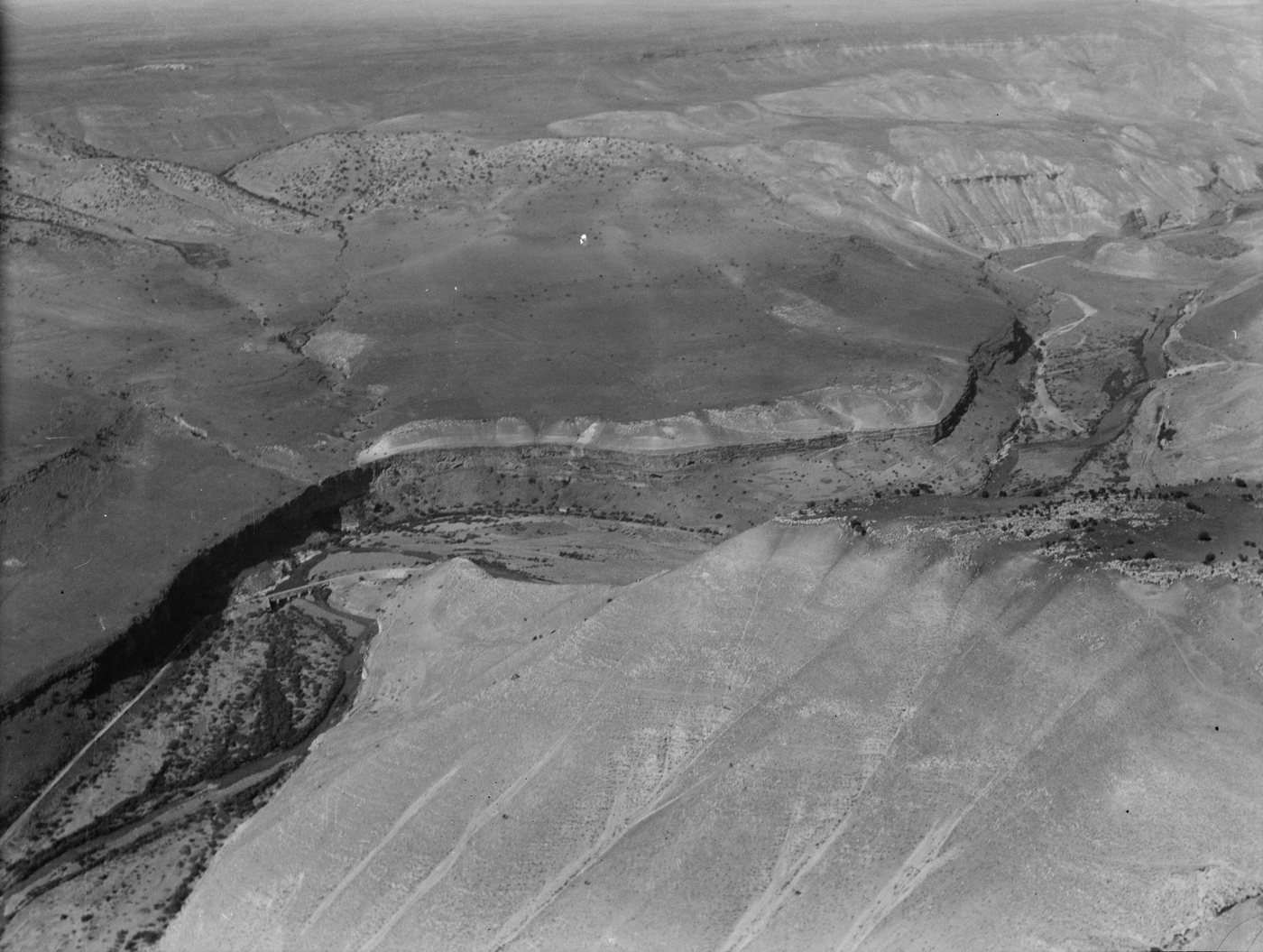 Aerial photograph of a deep river gorge cutting through a dry plateau