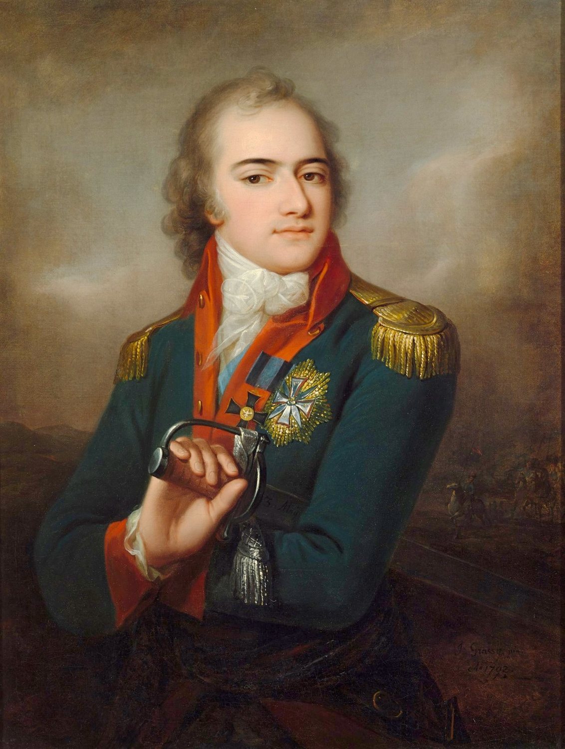 Portret do pasa młodego oficera w ciemnym mundurze z szarfą