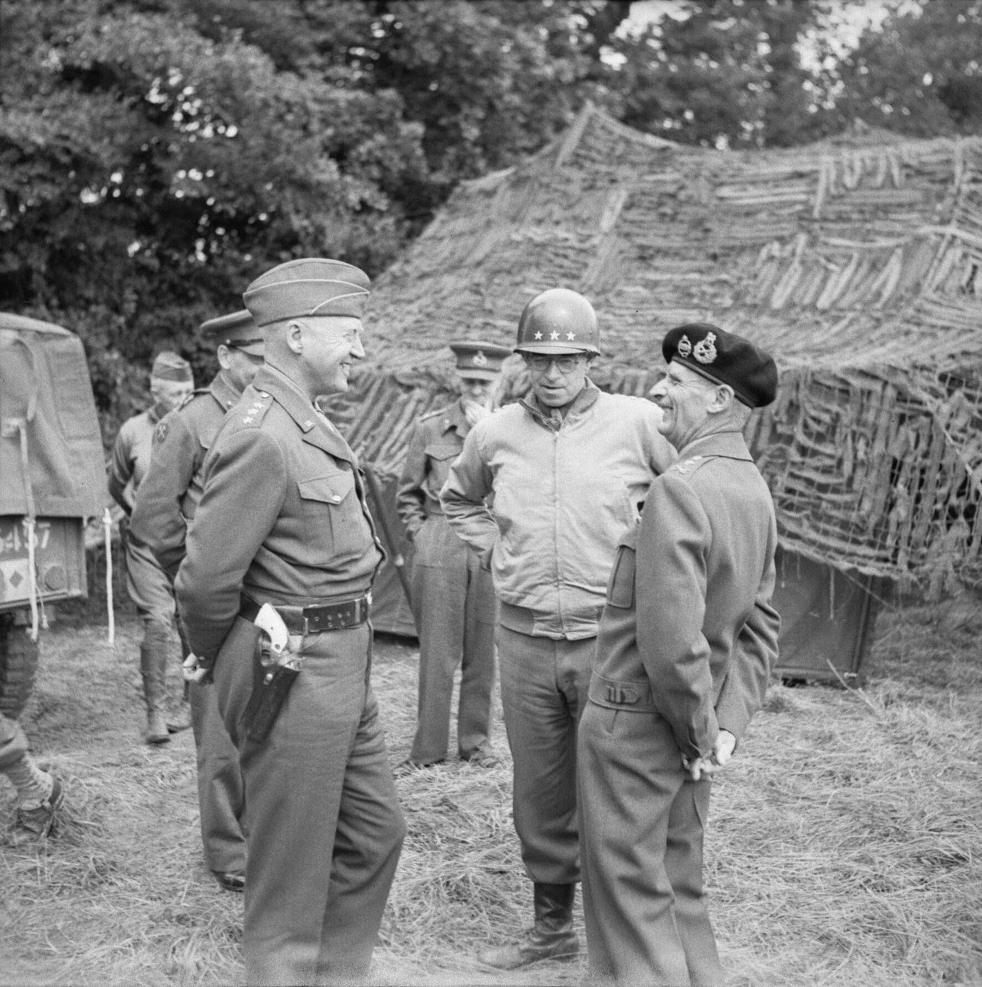 Three generals in uniform standing together outdoors