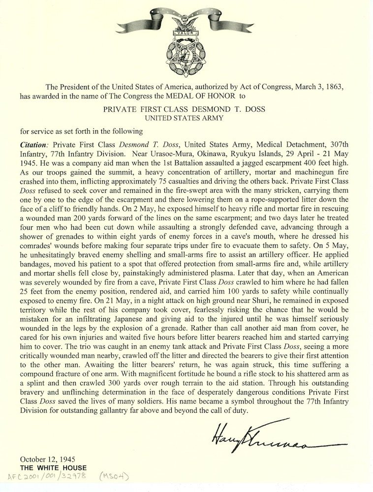 Typed Medal of Honor citation for Private First Class Desmond T. Doss with the medal emblem at the top and Truman's signature
