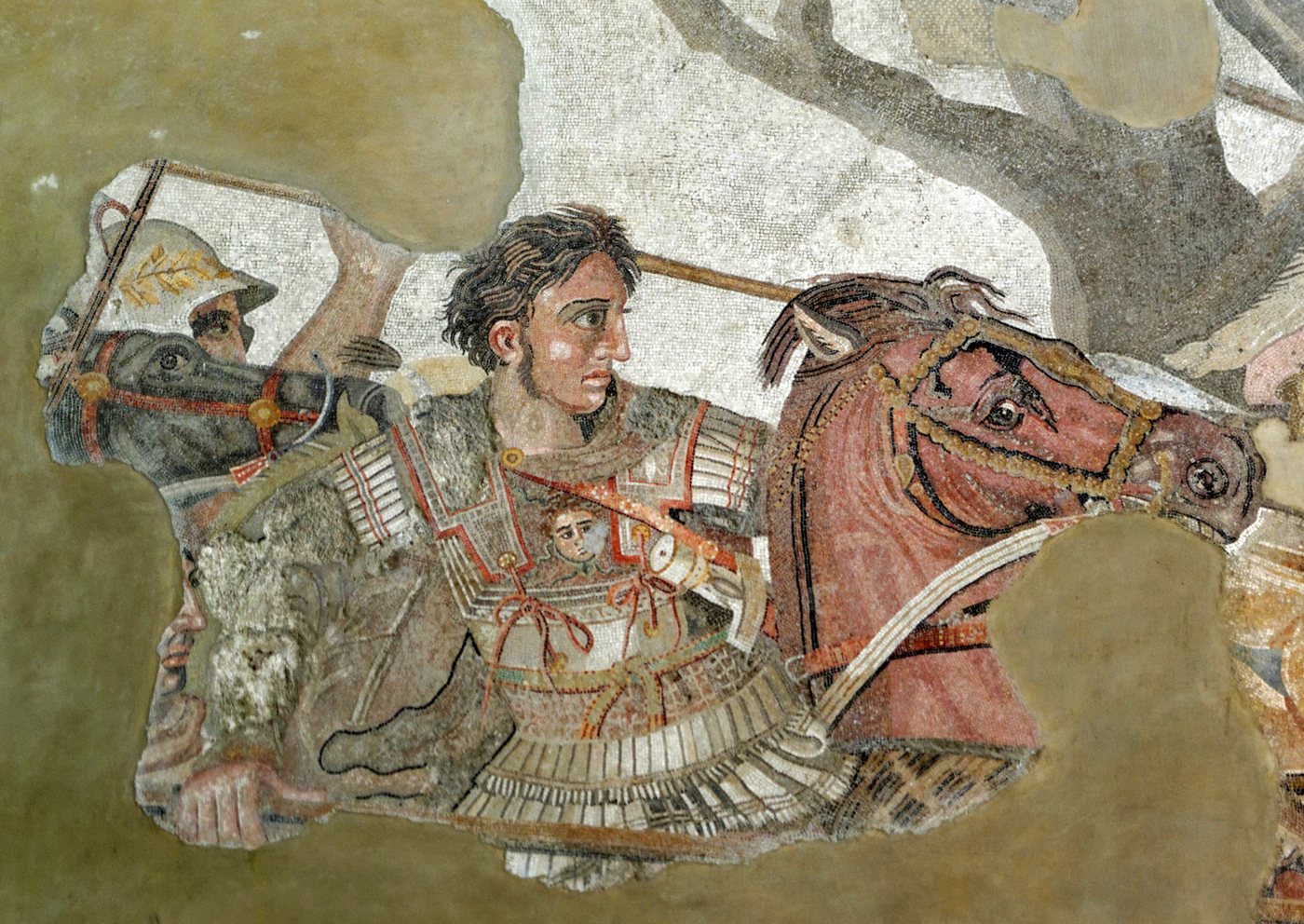 Ancient mosaic detail of a bareheaded young commander in armour riding a horse into battle