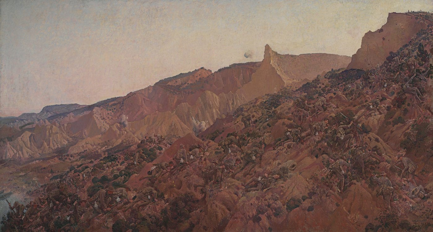 Painting of Australian soldiers climbing a steep, scrubby ridge above Anzac Cove under fire, with a yellow rock pinnacle rising behind them