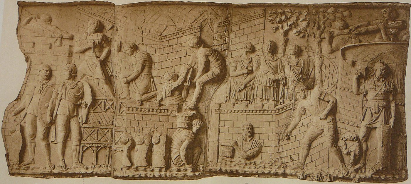 Relief of Roman soldiers carrying blocks and building a walled camp