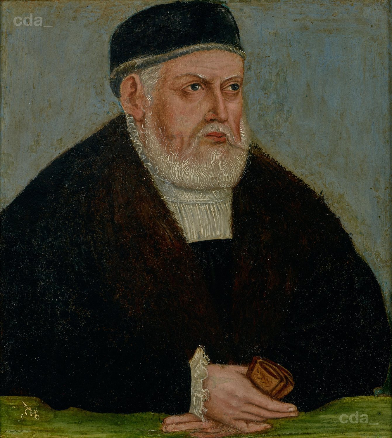 Portrait of an elderly bearded king in a fur collar and black cap