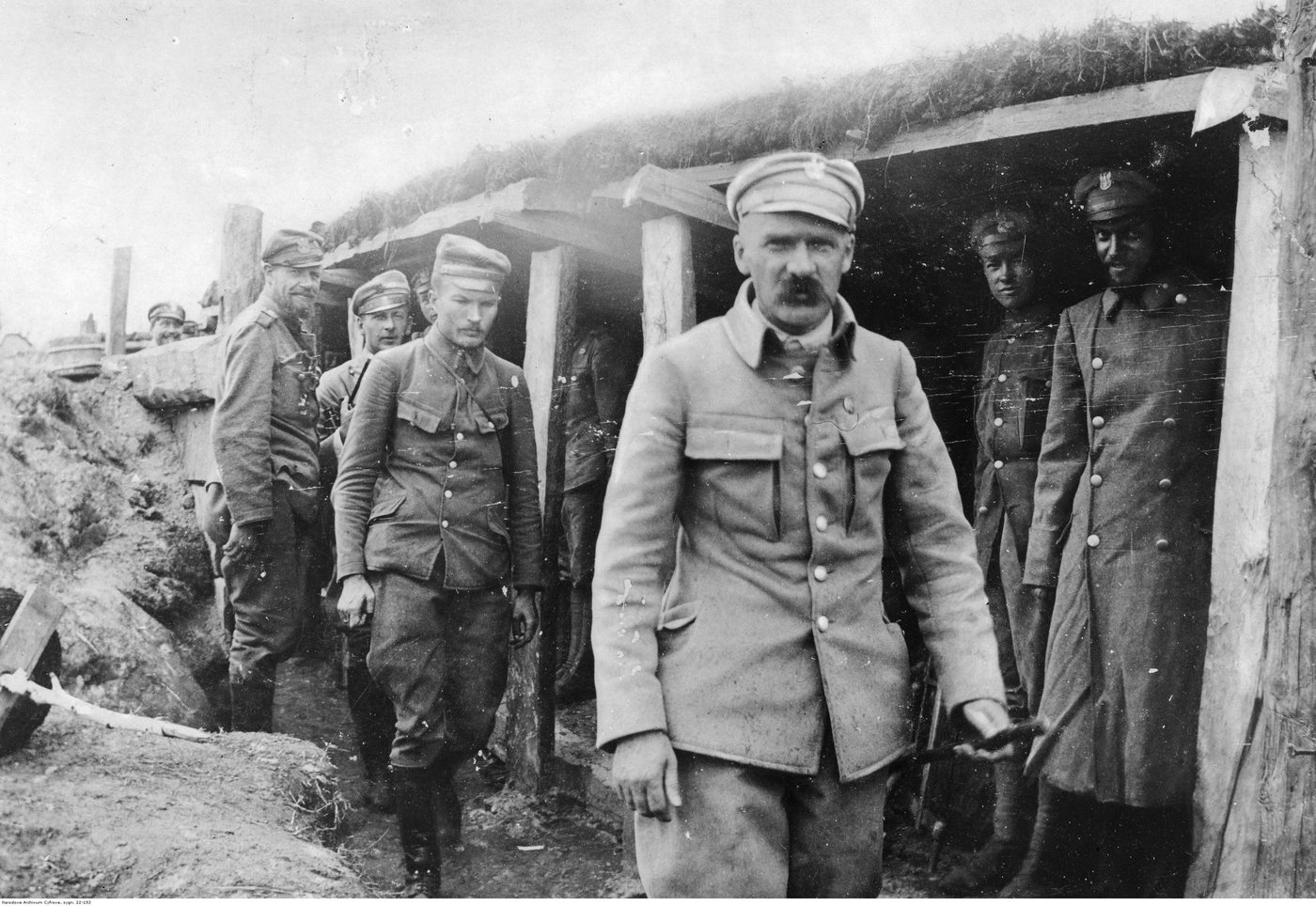 Józef Piłsudski standing with Legion officers in a trench, 1916