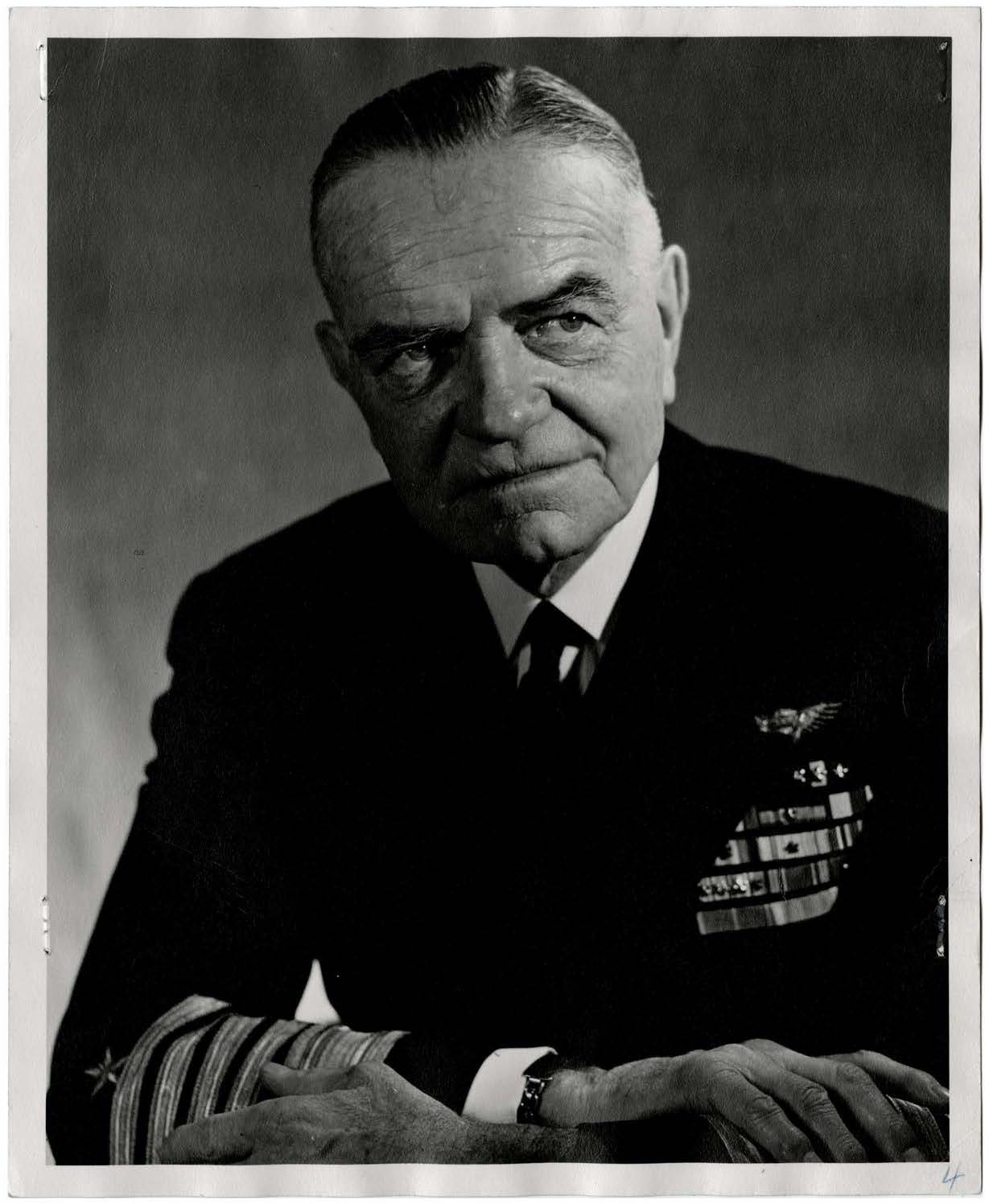 Black and white portrait of William Halsey in a dark naval uniform with rows of ribbons