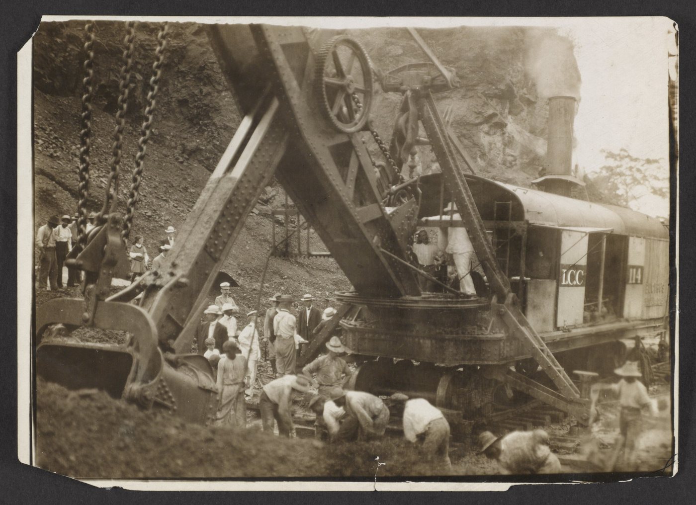 Photograph of a large steam shovel at a canal excavation with workers around it