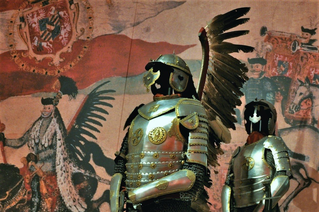 Polished steel hussar armour with tall feathered wings rising from the back