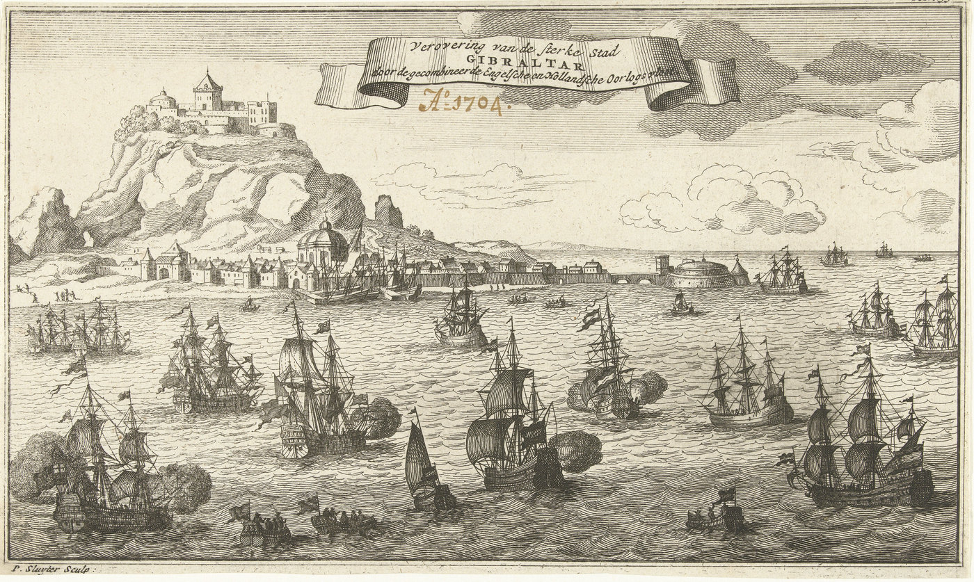 Etching of the Rock of Gibraltar with a castle on its summit and the walled town at its foot, while sailing warships fire their guns in the bay in the foreground under a banner with the title and the year 1704.